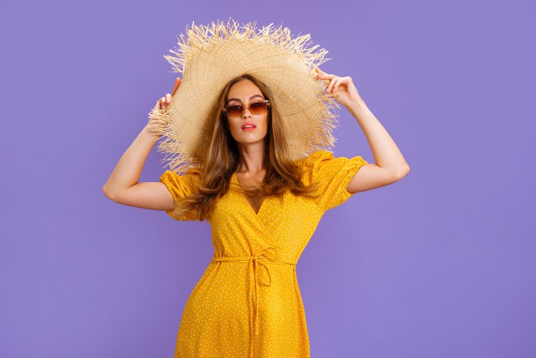 Elegant,Woman,In,A,Light,Yellow,Summer,Dress,,Sunglasses,And